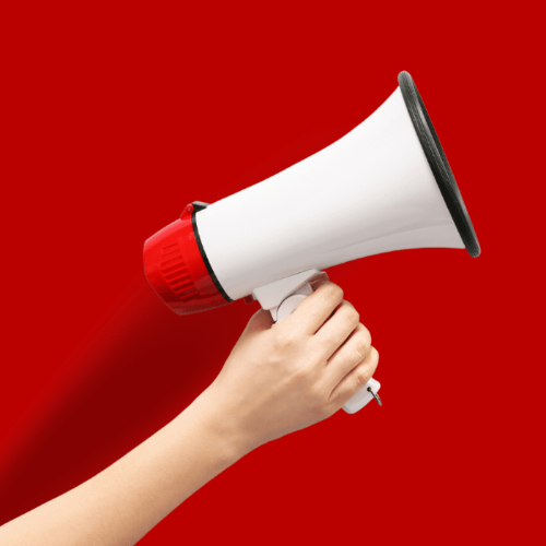 Person holding a megaphone on a red background